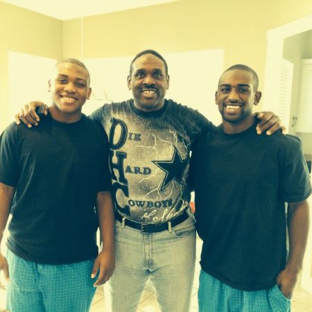 Nate posing with his two sons